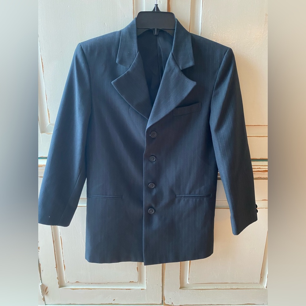 Boys size12 reg suit jacket. Navy blue pinstriped ,100% polyester lining .